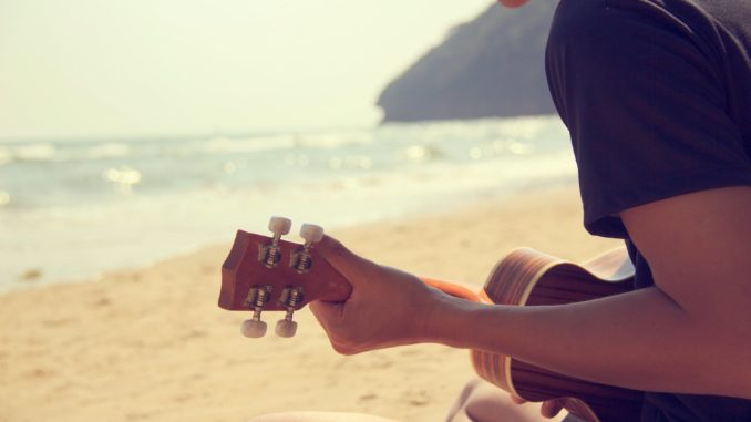 person playing ukulele