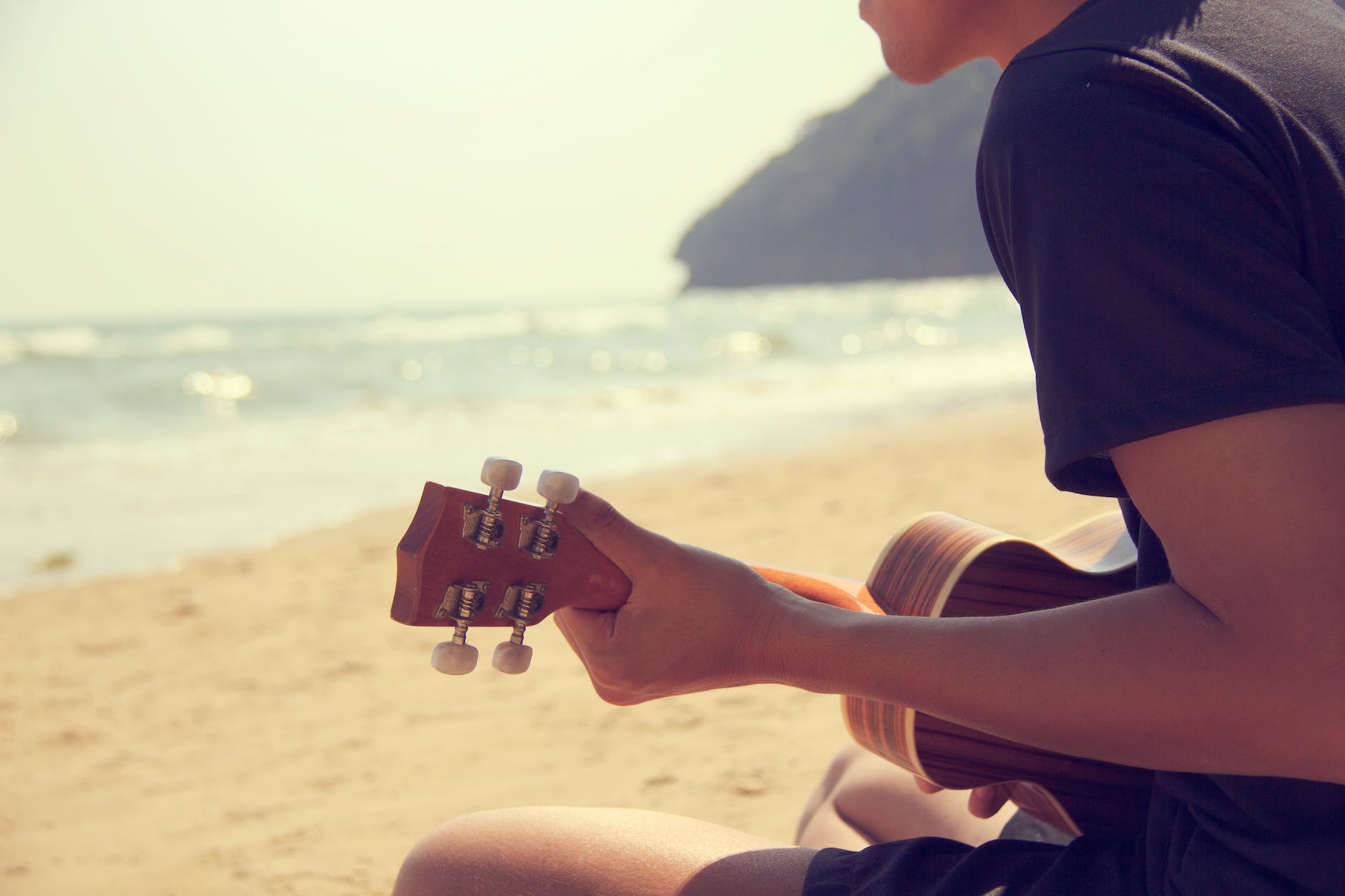 person playing ukulele